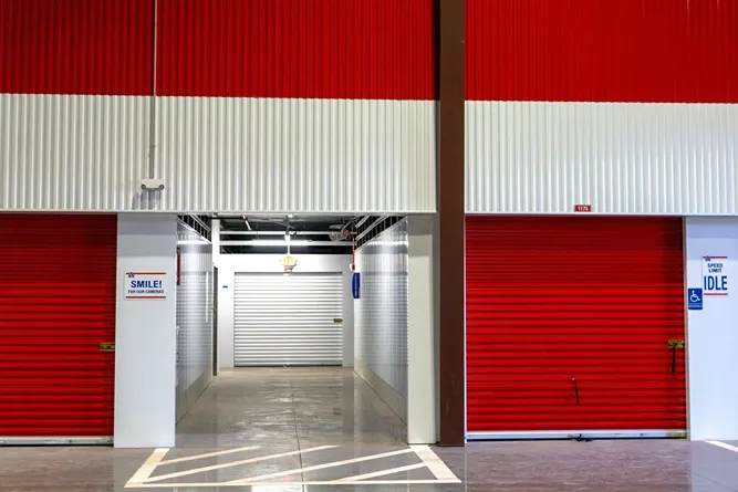 Indoor drive-up storage units with wide loading access inside facility
